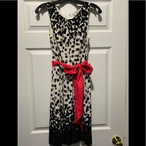 Black and white polka dot dress with pink belt